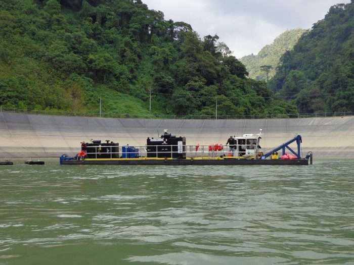 A DM 60 Depth Master dredge deepens a hydropower dam in Guatemala.