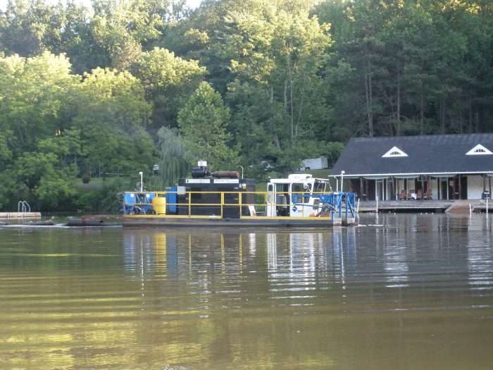 A contractor cleans out a lake for a private lake community in New Jersey.