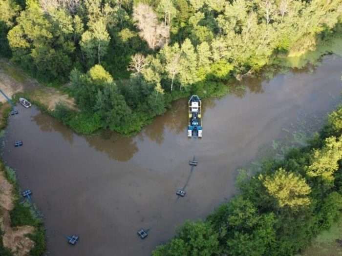 A 7012 HP Versi-Dredge performs maintenance dredging at a gun club lake in Wisconsin.