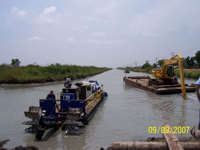 Two IMS Versi-Dredge units deepen a canal at a shrimp producer’s facility in Indonesia.