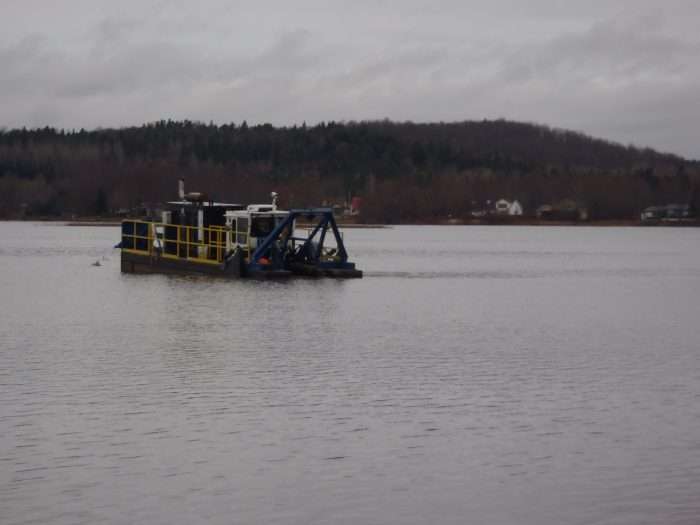 A Canadian contractor cleans out a larger lake using an IMS 7012 HP Versi-Dredge.