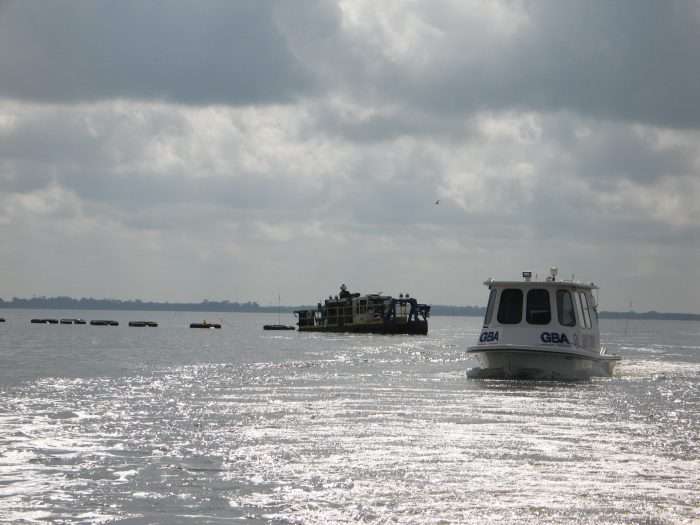 A 5012 HP Versi-Dredge preforms precision GPS channel dredging at an lake connected to the Gulf of Mexico.